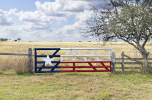 A painted ranch gate on West Texas ranch land