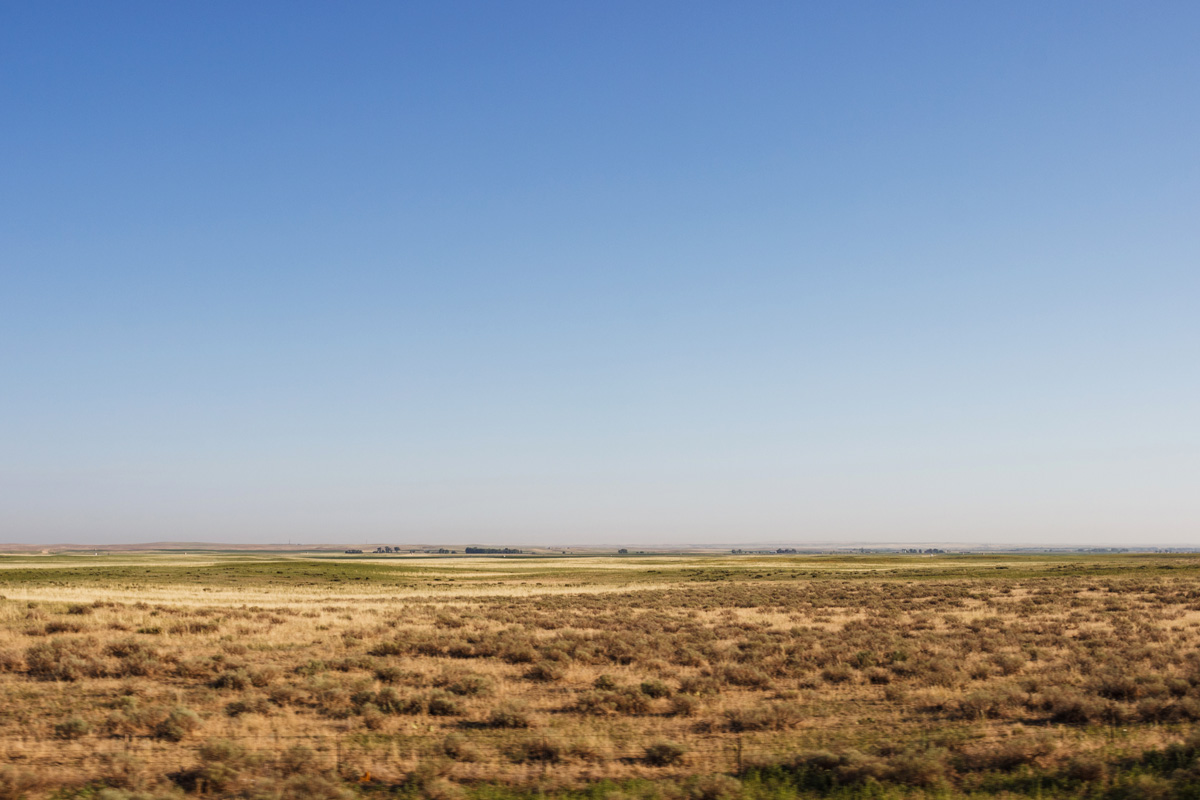 A flat West Texas landscape with a blue sky.